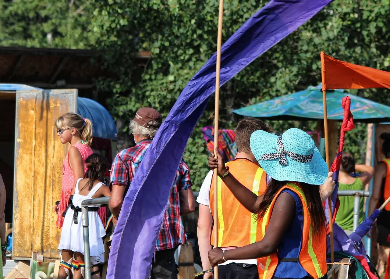 Volunteers with flags at Ness Creek festival, 2014