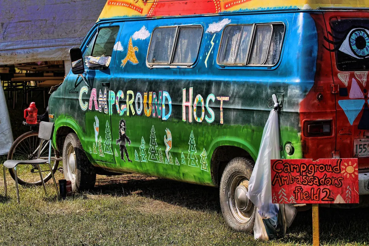 Painted Campground Host van at Ness Creek festival, 2014